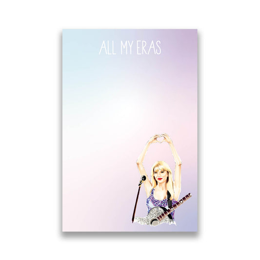A notepad with a colorful cover featuring an illustration of a person with a microphone and text that reads 'ALL MY ERAS'.